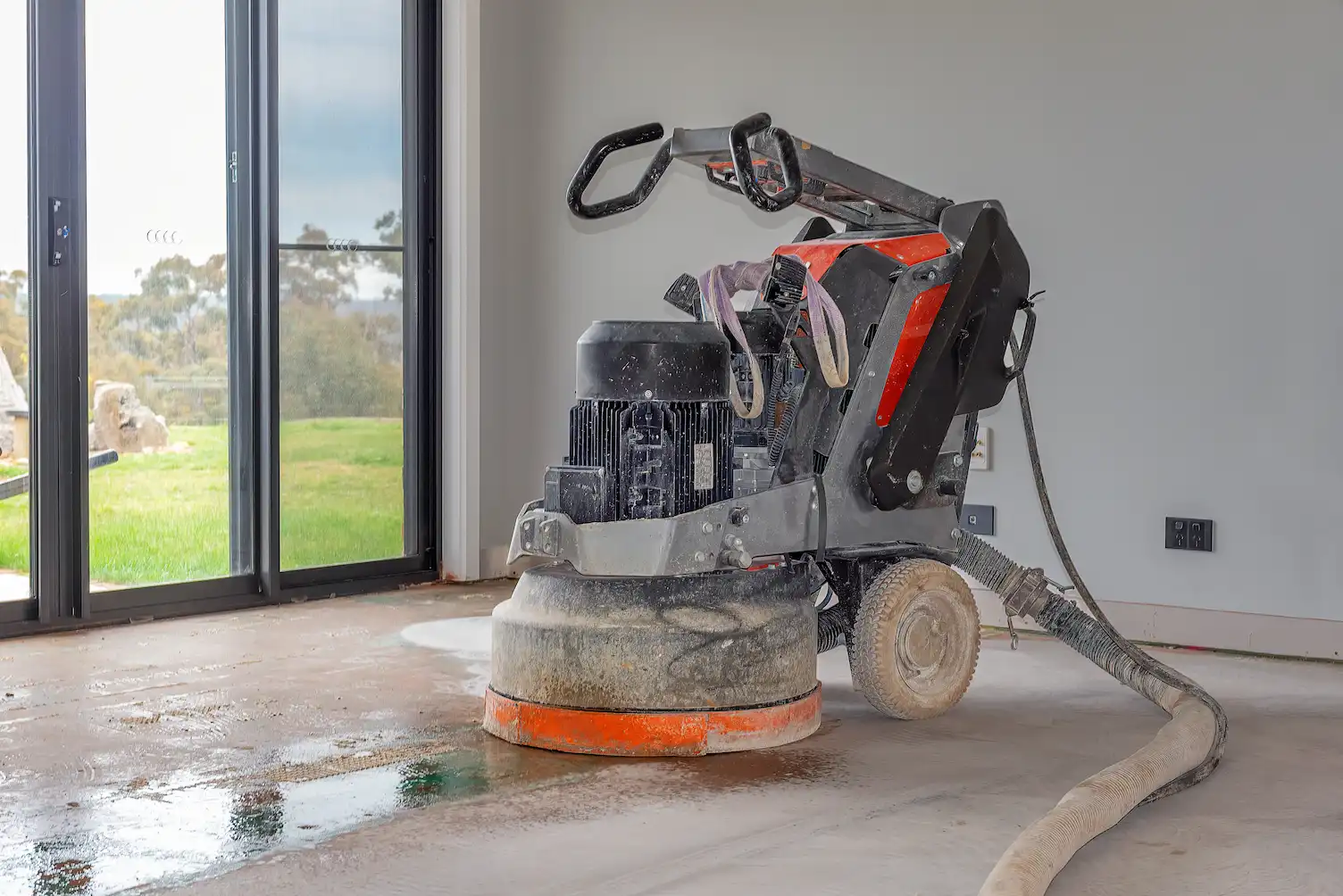 Concrete floor grinding during professional concrete polishing process